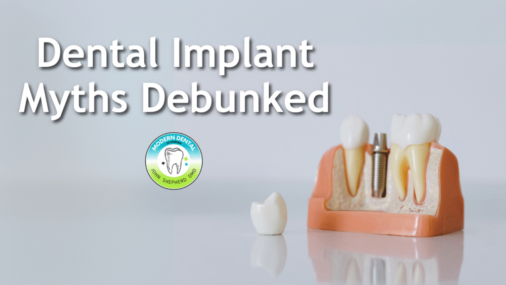 A dental implant model showing the titanium post and crown used to replace a missing tooth, illustrating common dental implant myths.